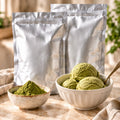 Two unlabeled silver wholesale Ryori matcha bags with matcha ice cream and powder